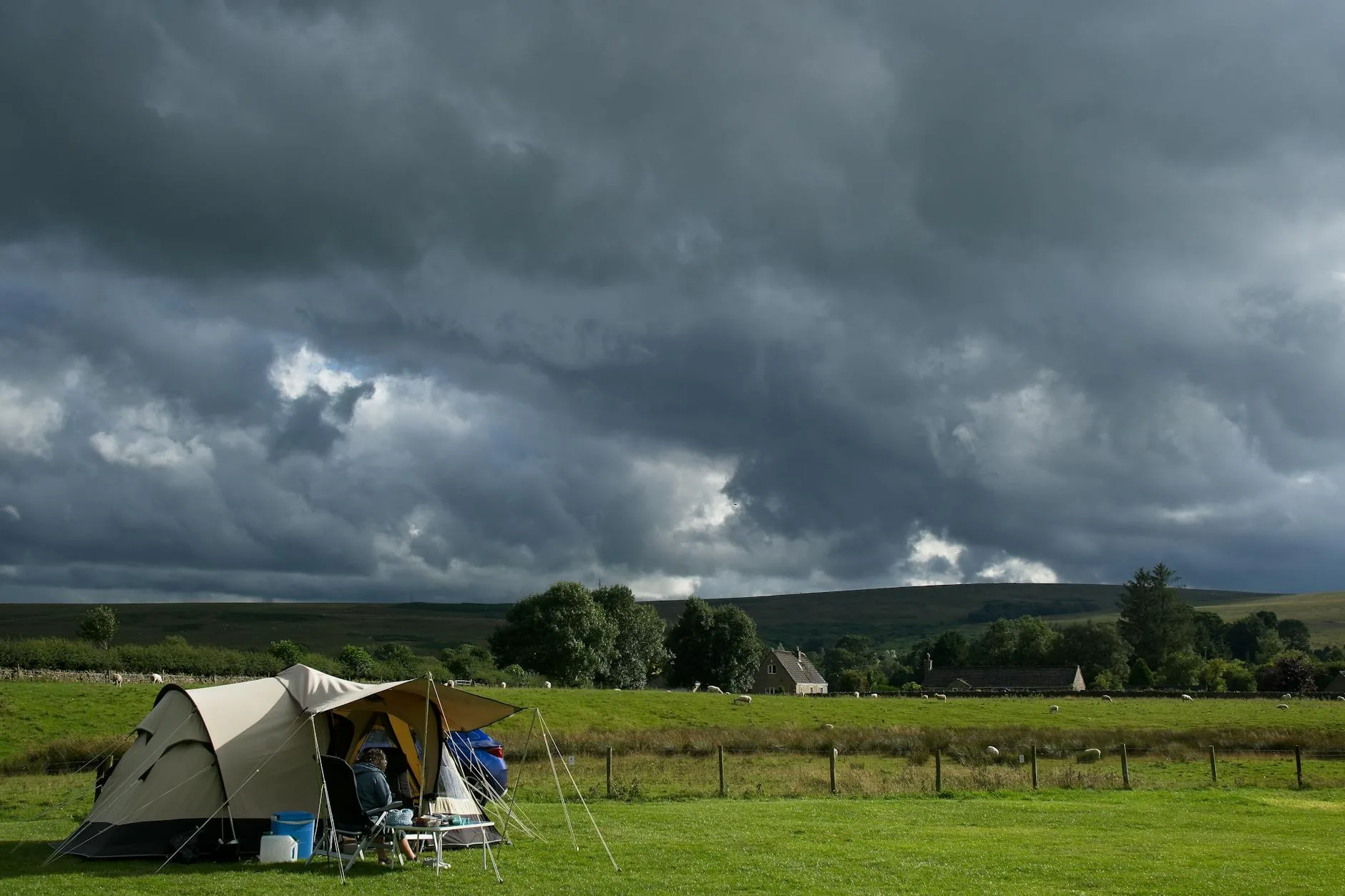 Beginner setting up tent at a UK campsite