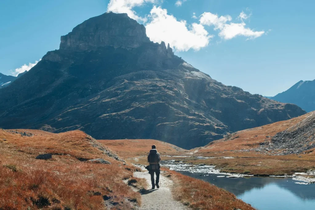 Hiker wearing base layer and jacket in UK mountains
