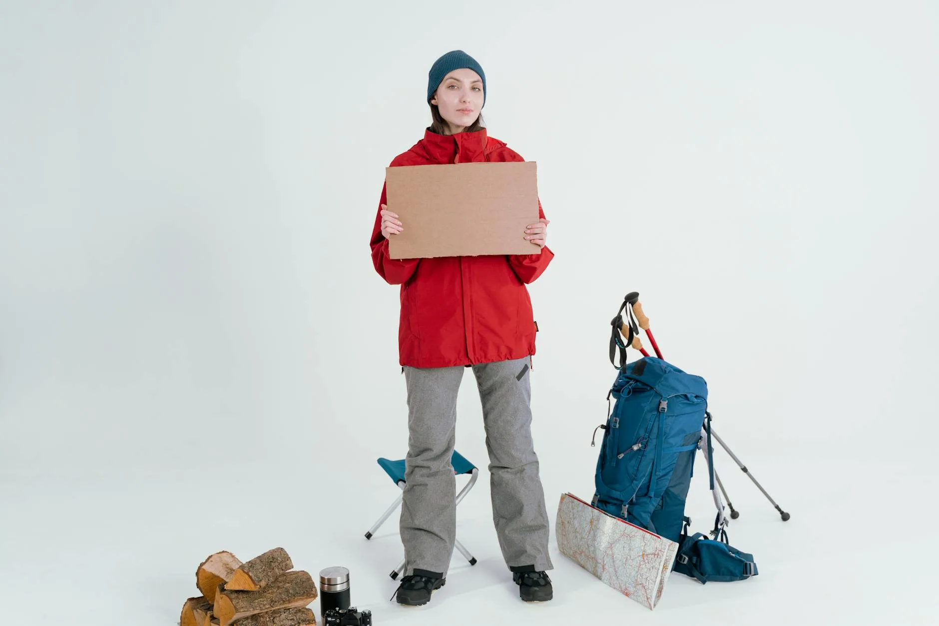 Hiking gear and waterproof jacket packed with a backpack