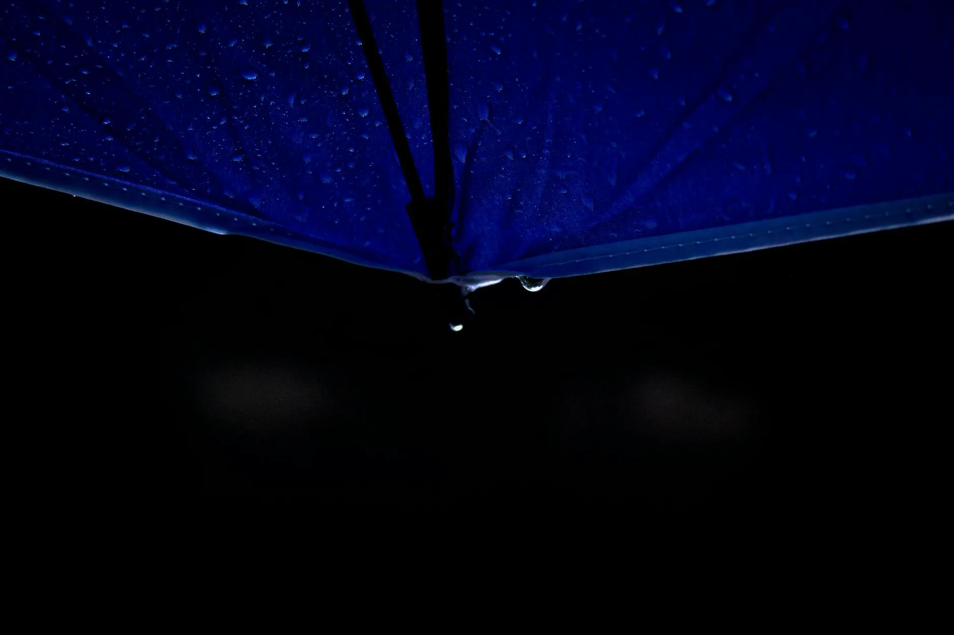Water droplets beading on waterproof jacket fabric surface