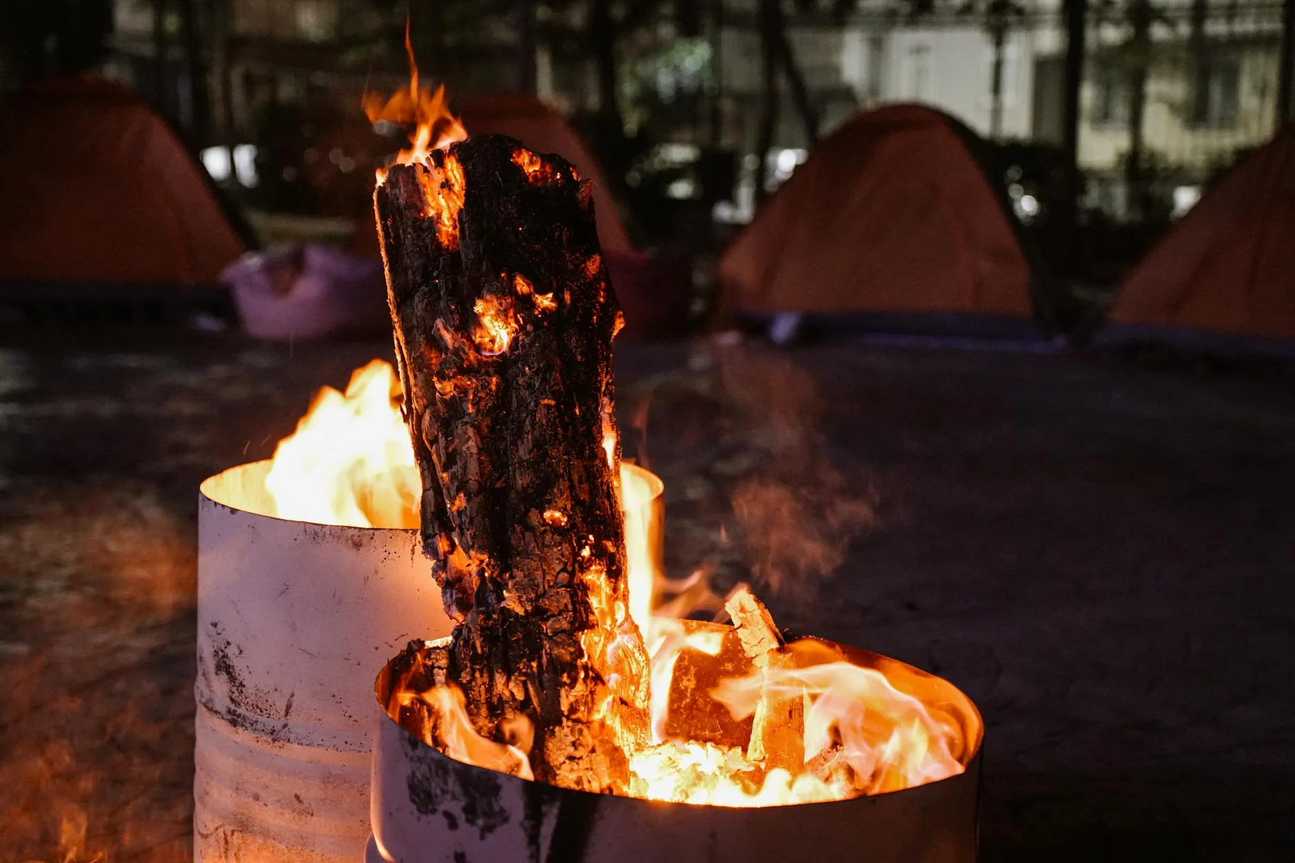 Warm campfire at night at an outdoor camping spot