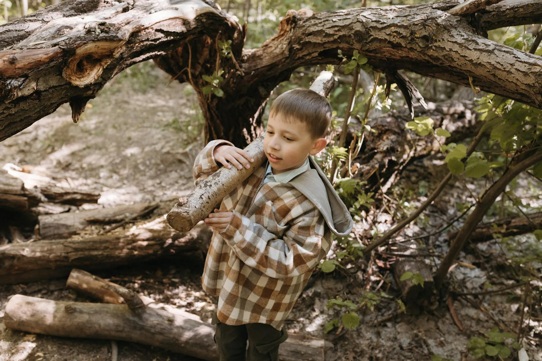 Child exploring nature on a woodland adventure outdoors