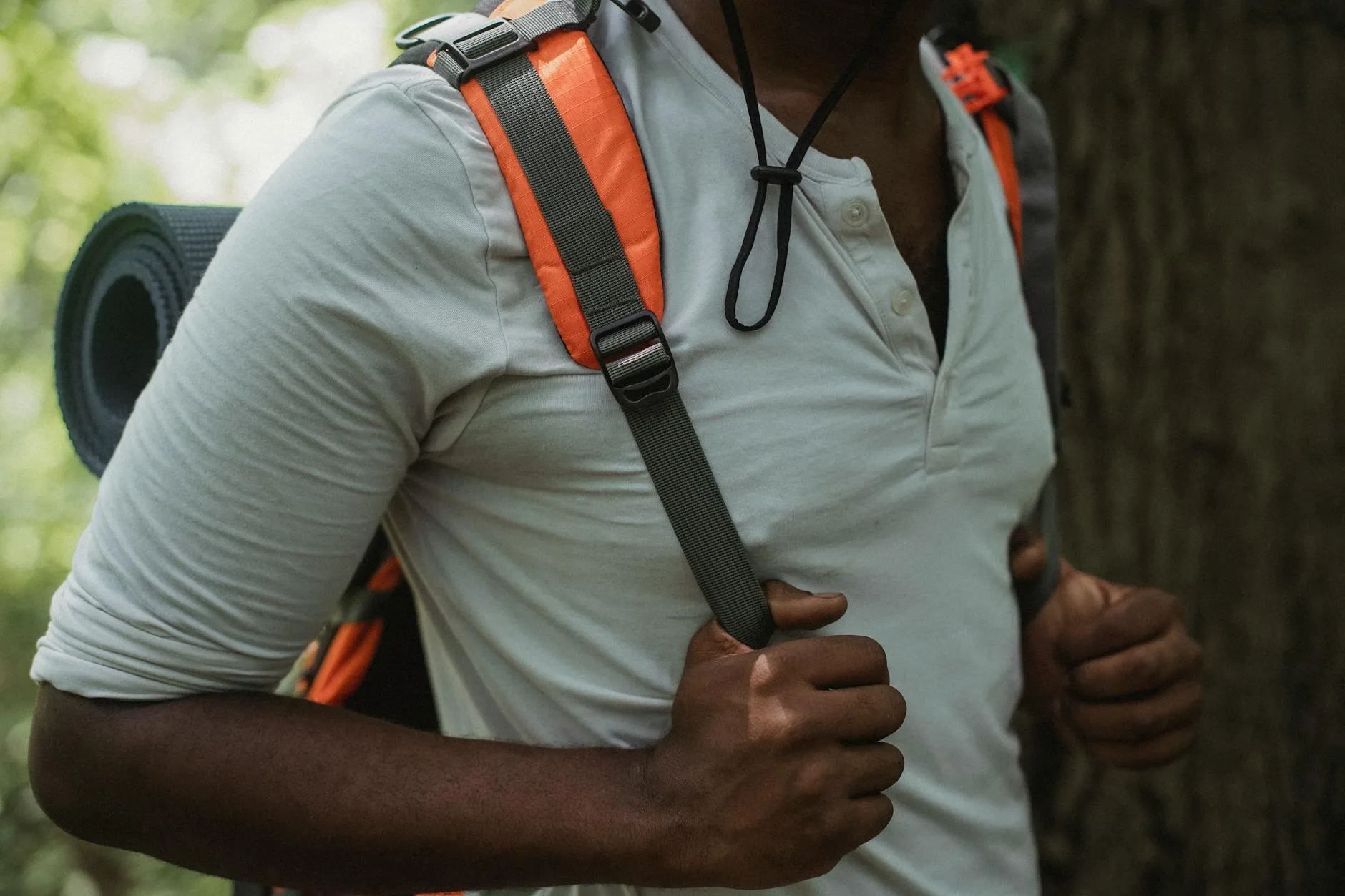 Hiking rucksack stored on a hook in an organised closet