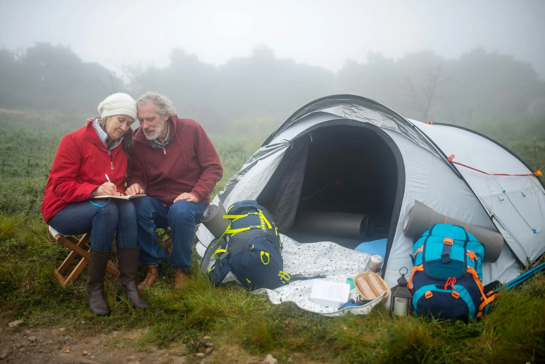 Person sleeping cosily in a sleeping bag inside a tent