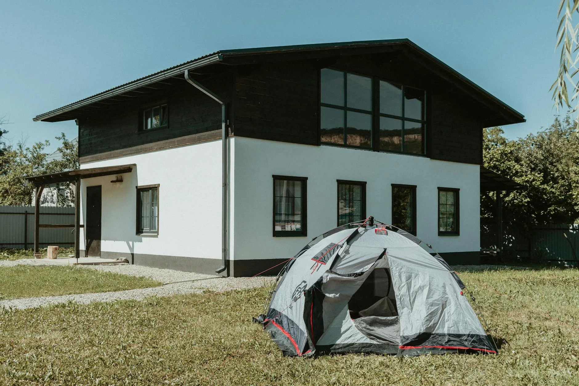Small tent quickly pitched on grass in a field