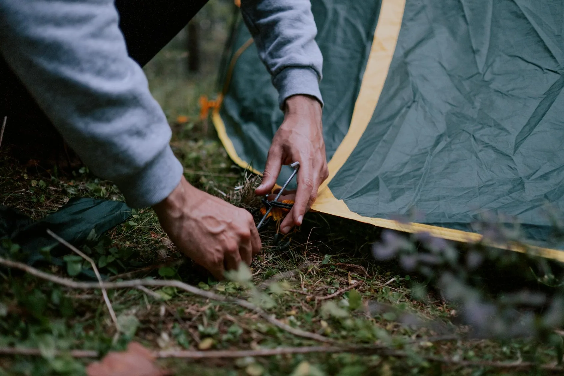 Tent guylines properly anchored to the ground with pegs