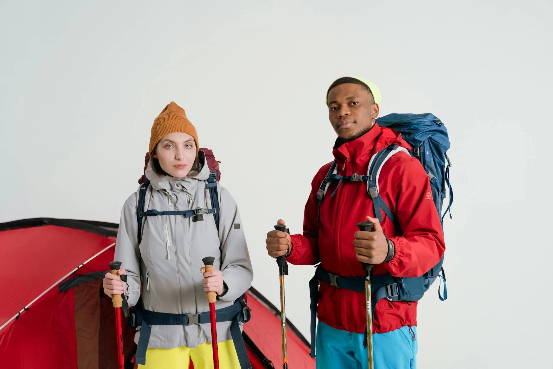 Travel backpack with outdoor gear and equipment laid out