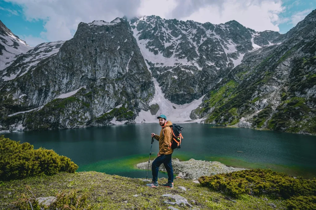 Hiker with a lightweight backpack on a mountain trail