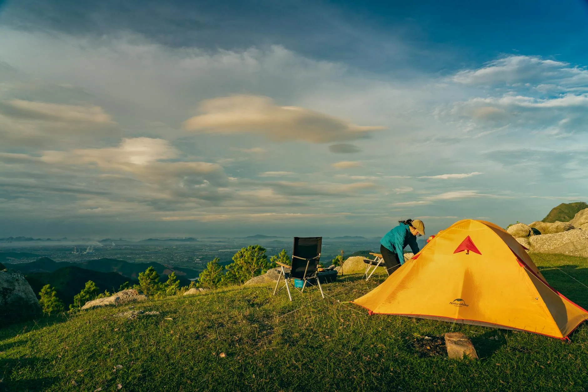 Wild camping tent pitched in the mountains at dawn