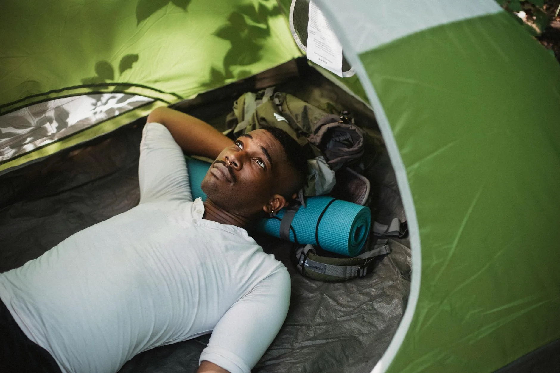 Camping sleeping gear packed for outdoor trip