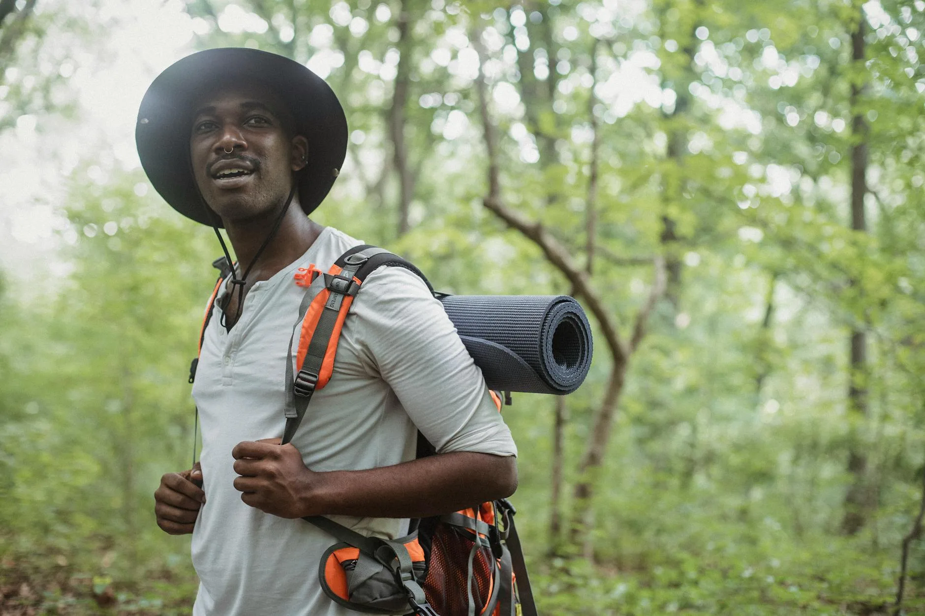 Hiker with rucksack on a mountain trail