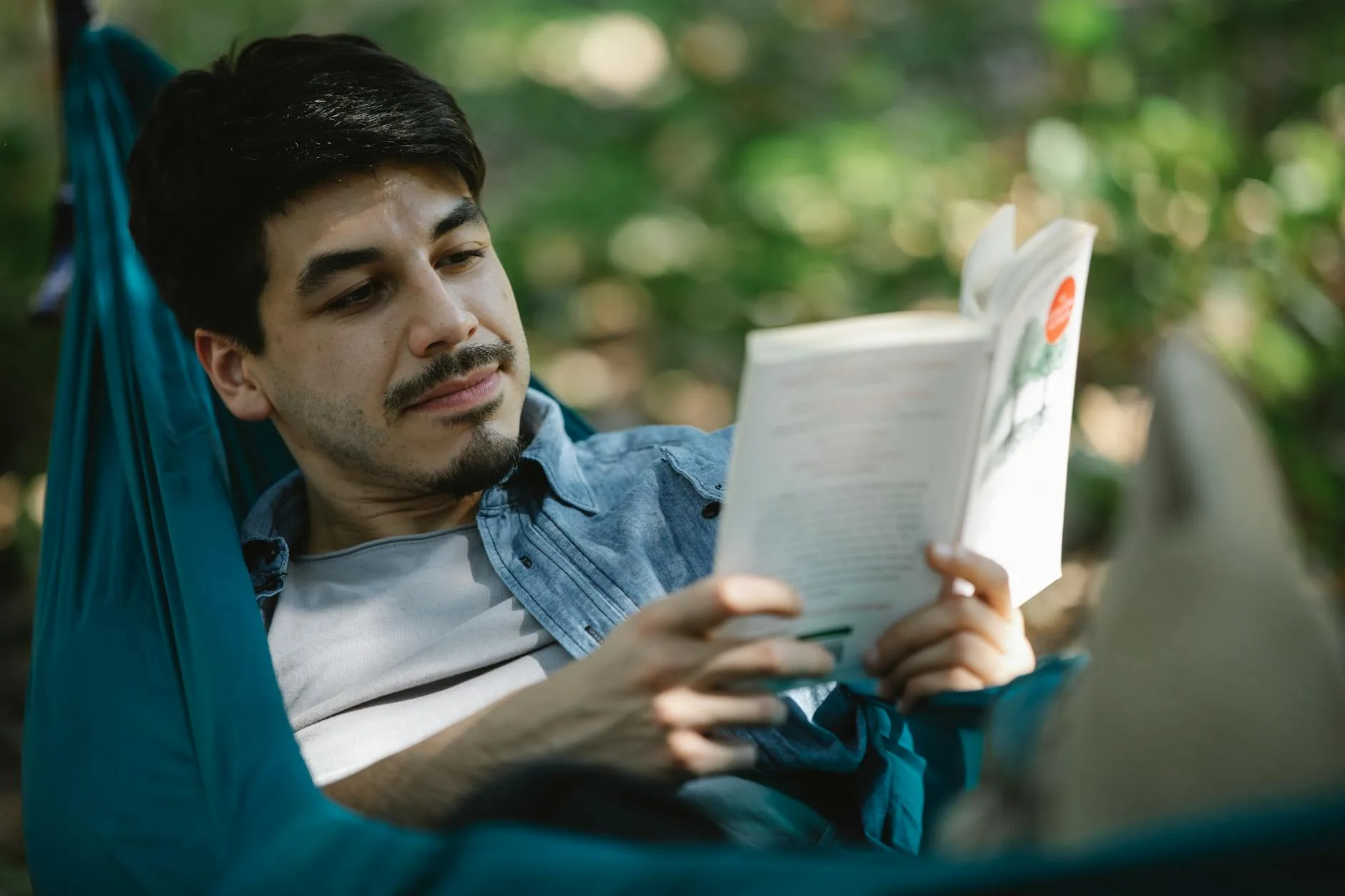 Person relaxing in a hammock in nature