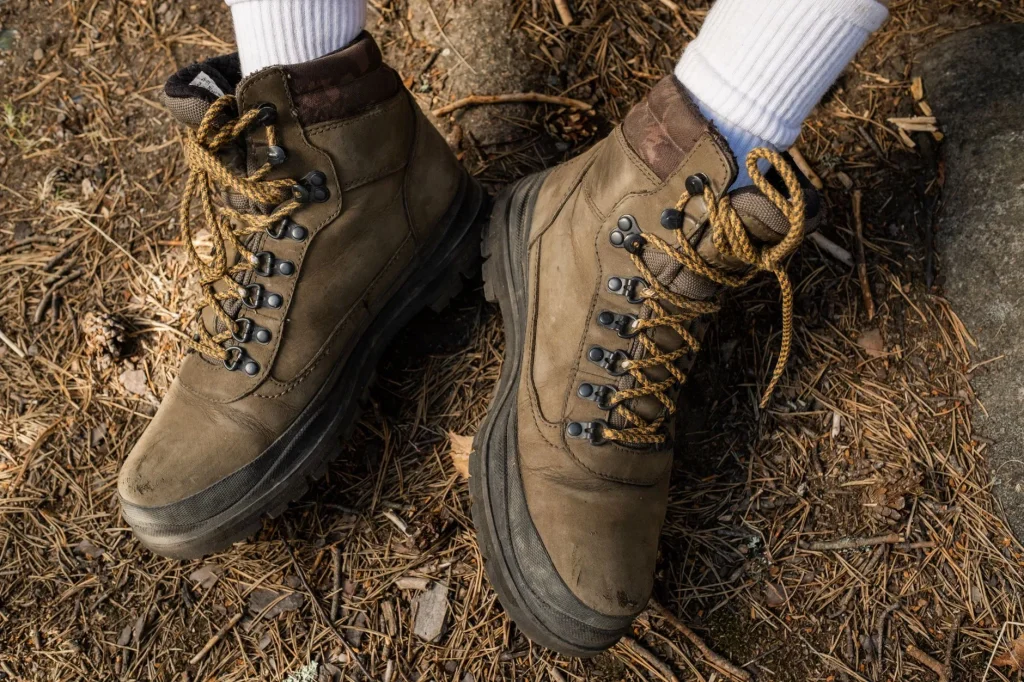 Hiking boots on a trail for blister prevention advice