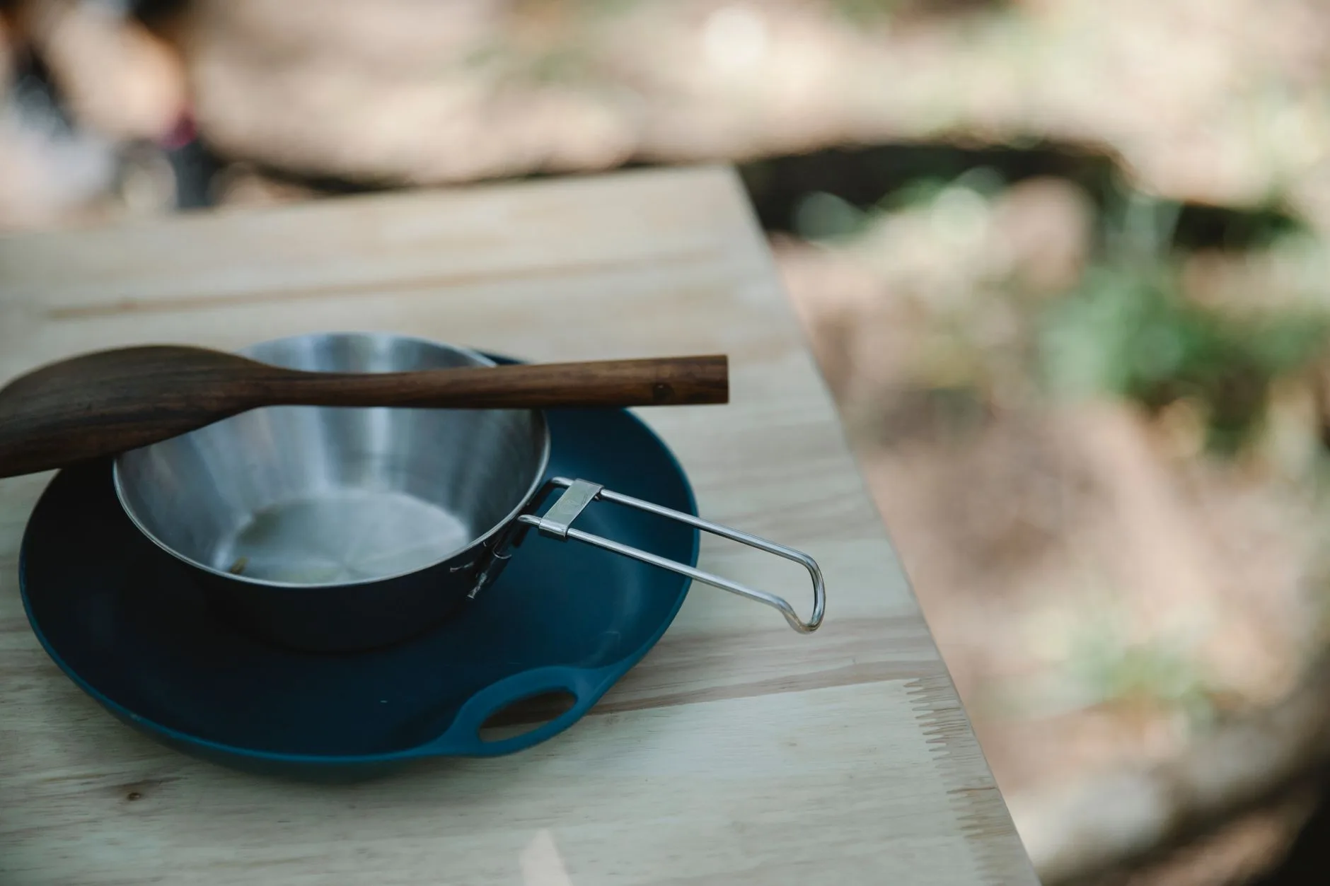 Camping cookware and utensils drying after washing outdoors