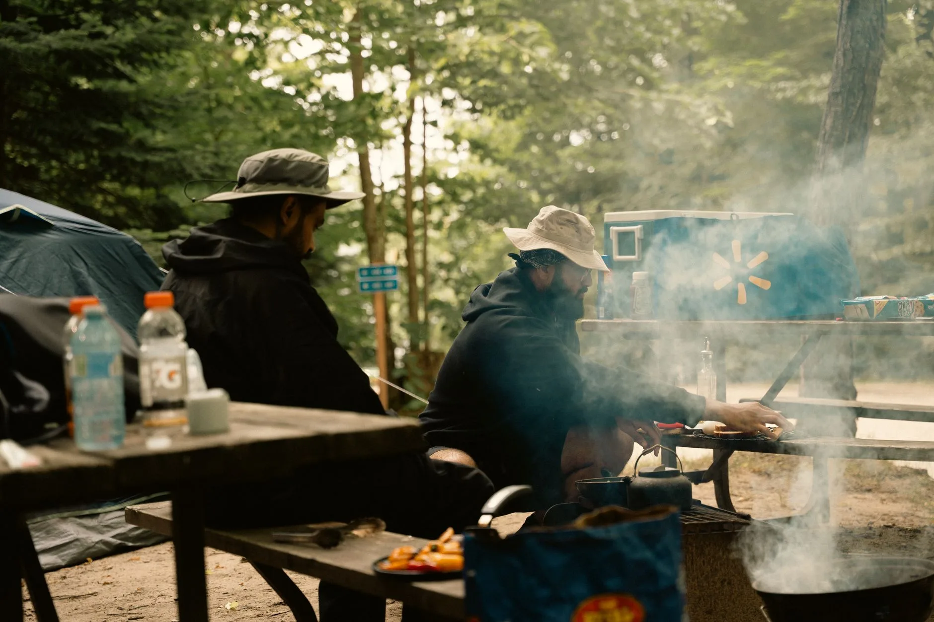 Camping cookware being washed at a campsite kitchen area
