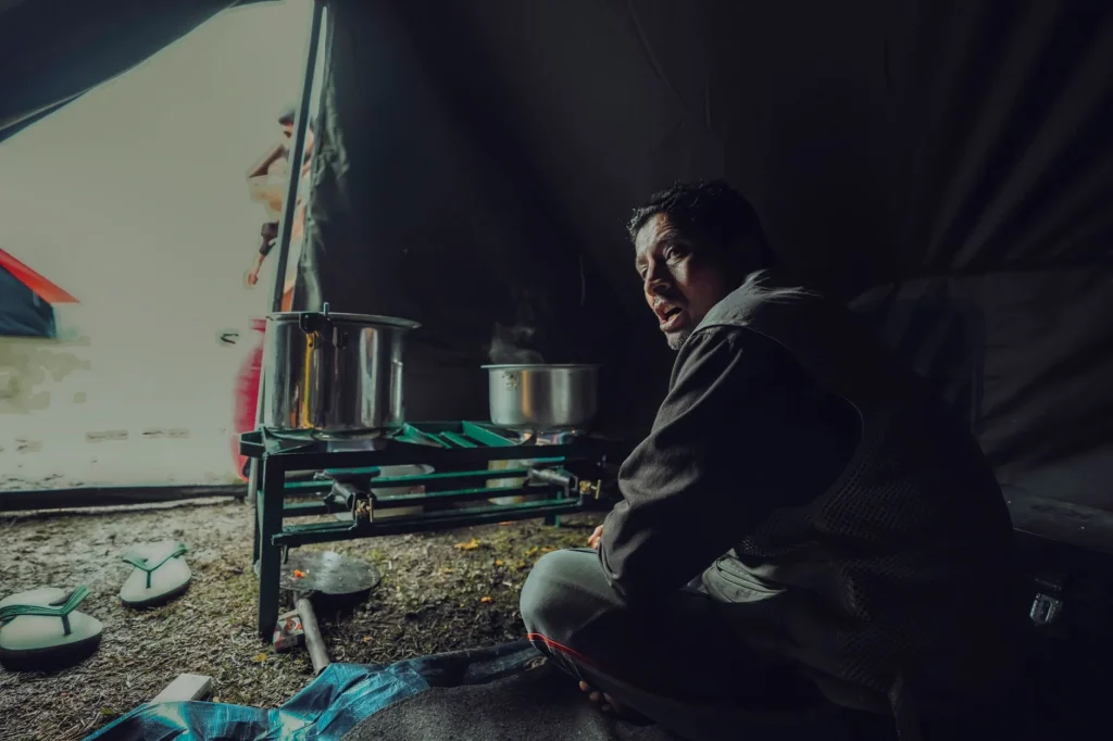 Mess tin cooking on a camping stove outdoors