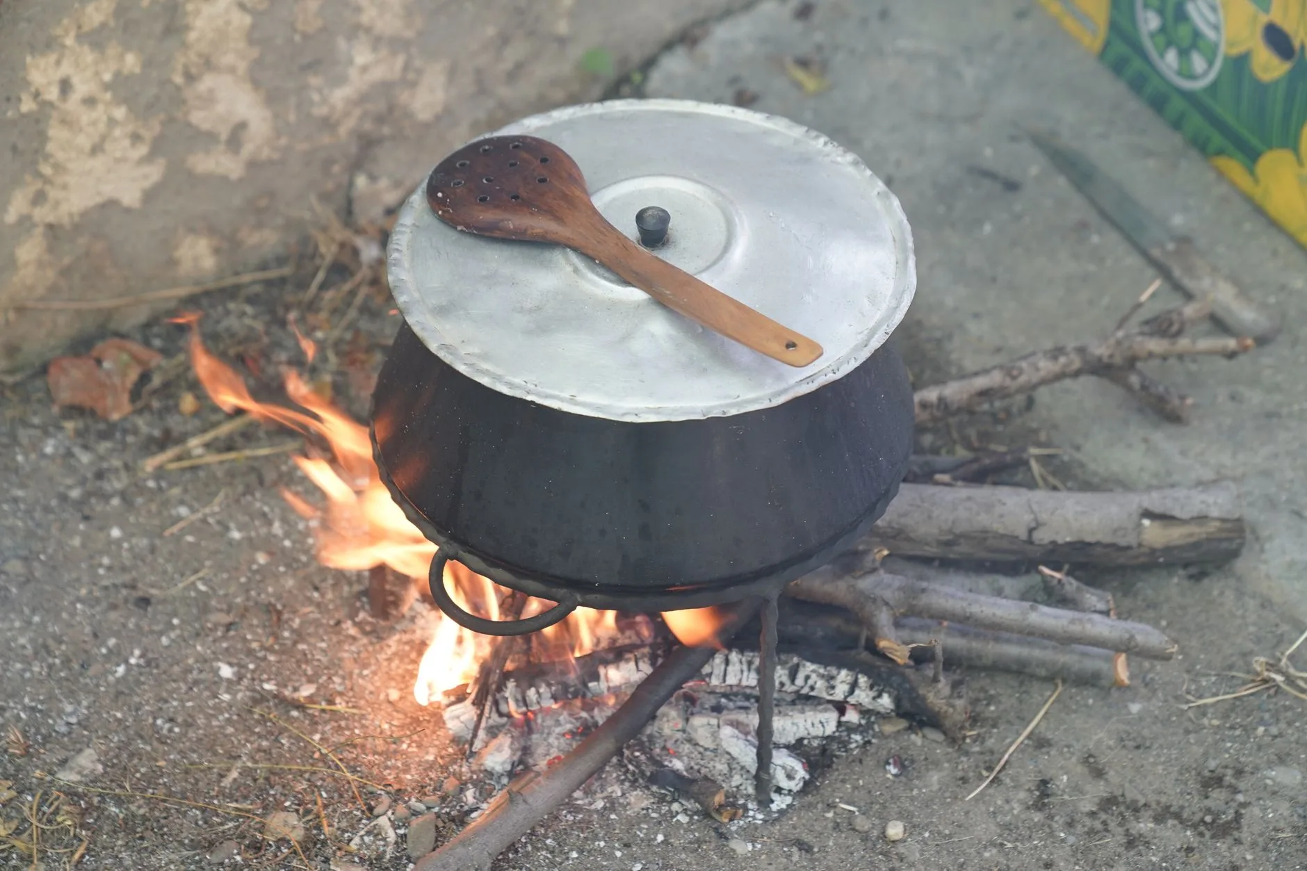 Small camping stove cooking a simple outdoor meal