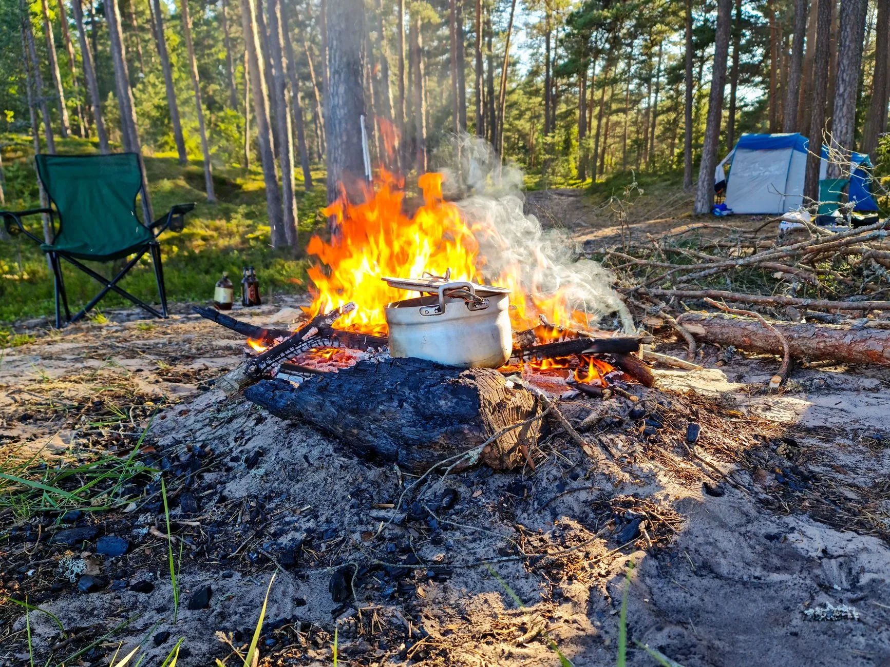 Lightweight camping pot on a small stove outdoors
