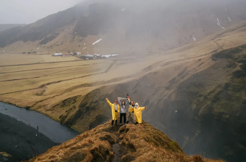 Hikers wearing waterproof layers on a UK mountain trail