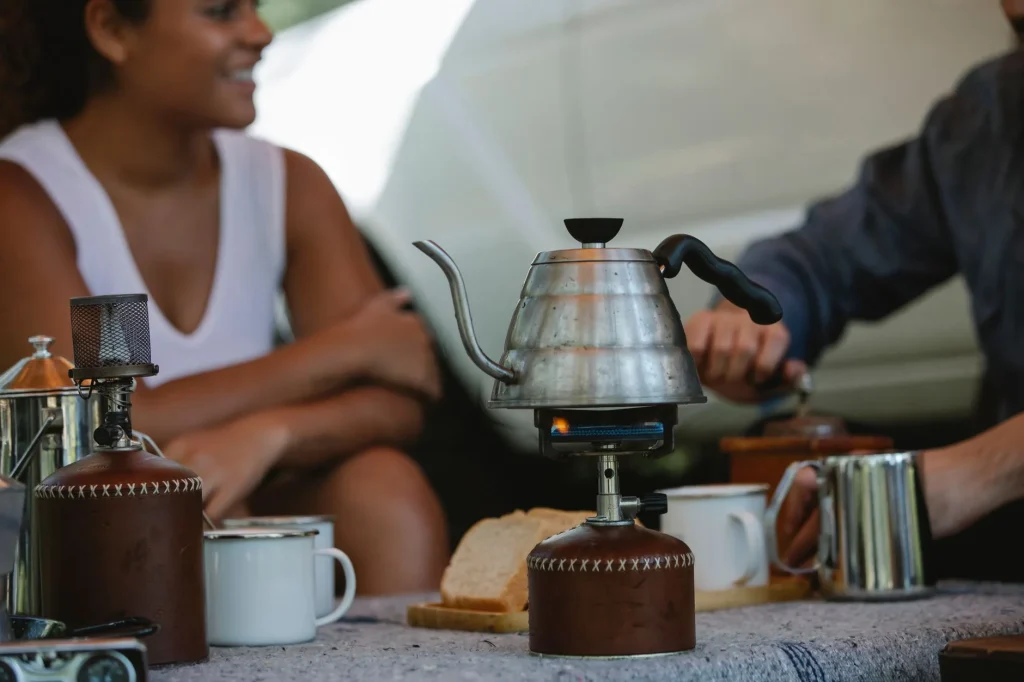 Camping kettle on a stove at a UK-style campsite